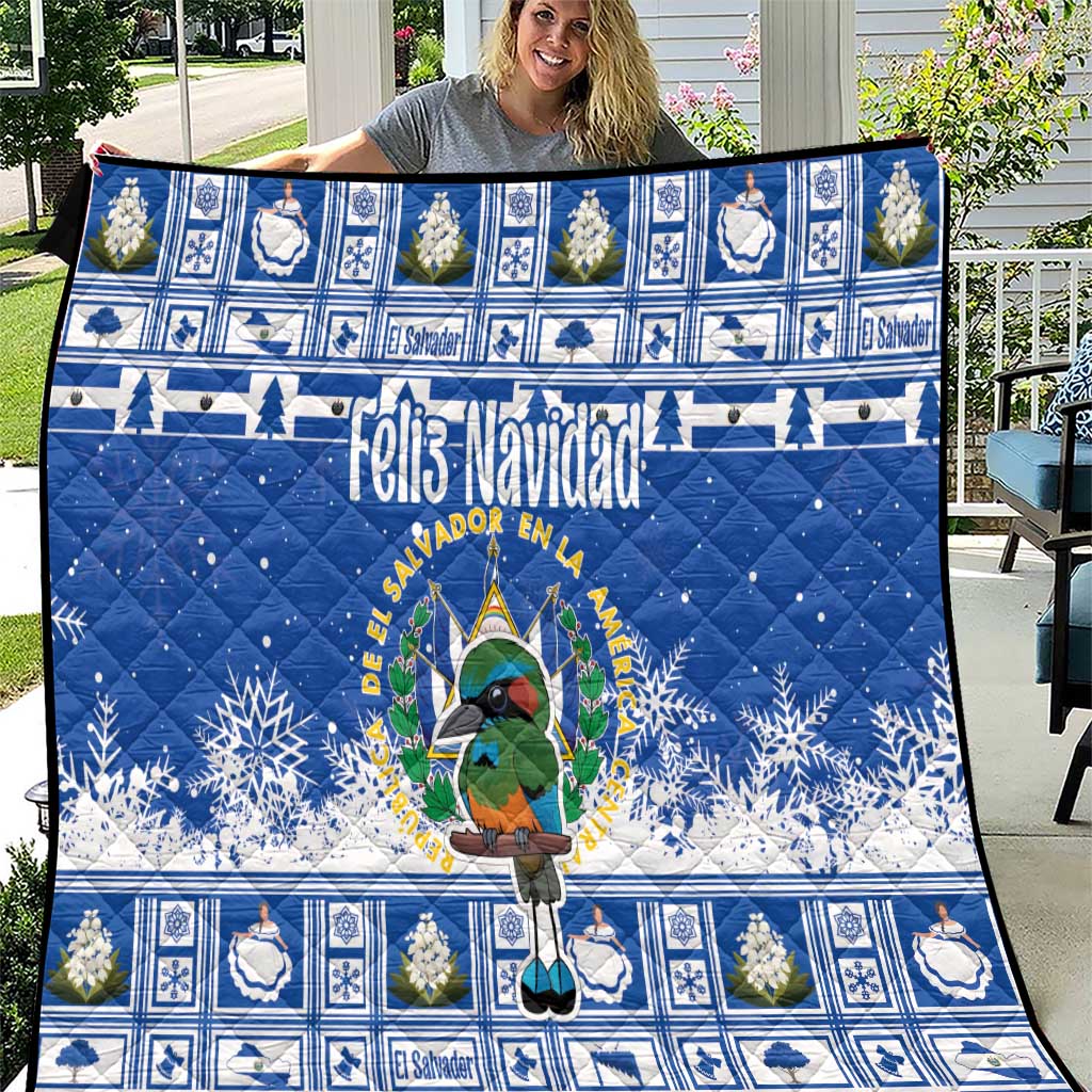 Blue Christmas quilt with cartoon bird and “Feliz Navidad” headline, blue-and-white blocks