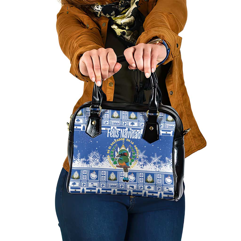 Blue Christmas shoulder handbag with black handles and festive front graphic.