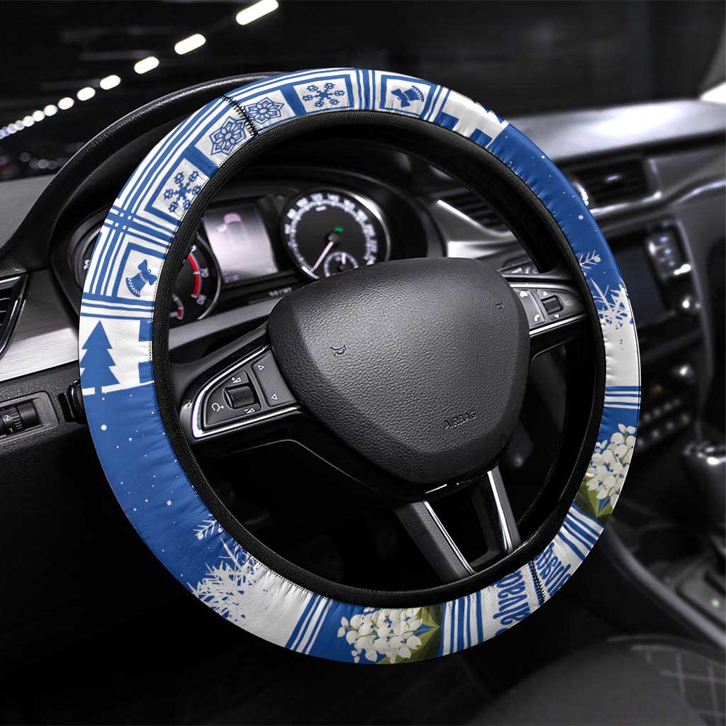 Blue and white patterned steering wheel cover with black trim and holiday tree motif