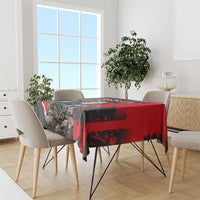 Red and black knight and dragon tablecloth draped over rectangular dining table