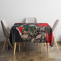 Red and black knight and dragon tablecloth covering dining table with four chairs