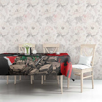 Red and black knight and dragon tablecloth spread across dining table