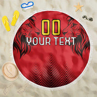 Red round beach blanket with fringed edge, lion graphics, '00' and 'YOUR TEXT'.