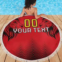 Red round beach blanket with fringed edge, lion graphics, '00' and 'YOUR TEXT' center print.