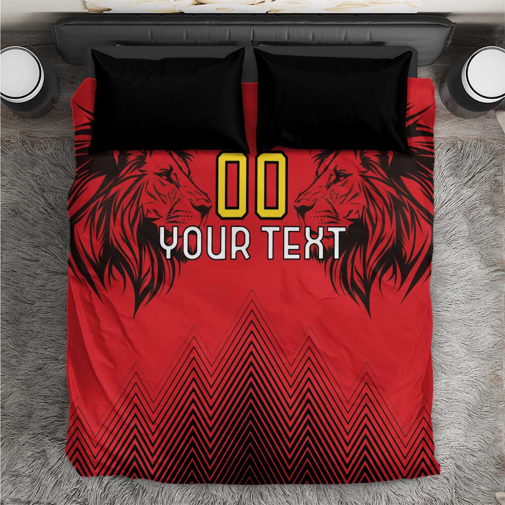 Red duvet cover with black lion graphic, geometric chevrons, and two black pillowcases