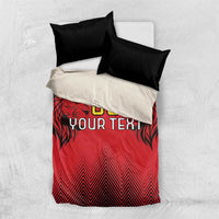 Red duvet cover with lion graphic and 'YOUR TEXT' print, with two black pillowcases