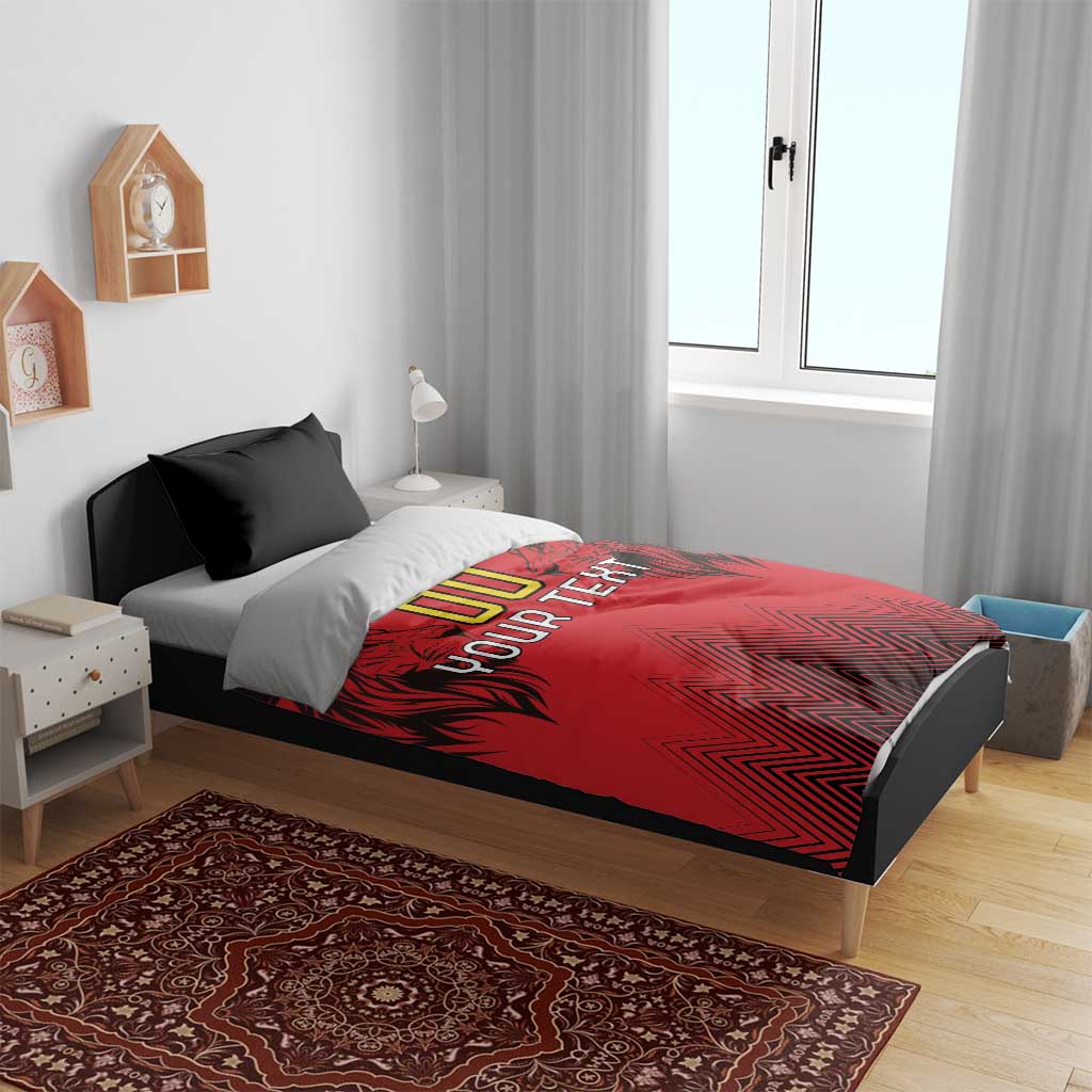Red duvet cover and two black pillowcases with lion head, 'YOUR TEXT' text, chevrons