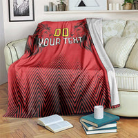 Red rugby blanket with lion head graphics and “00 YOUR TEXT,” showing white reverse edge
