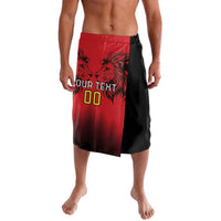 Red and black rugby shorts with lion graphic, zigzag trim, and side slit
