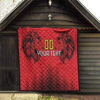 Red quilt blanket with black palm-lion artwork, gold “00” and “YOUR TEXT” on front