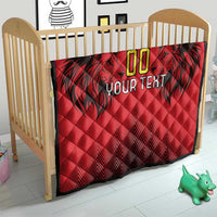 Red custom quilt blanket on crib with black palm graphic, gold “00” and “YOUR TEXT”