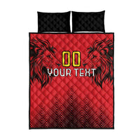 Red quilt bed set with black back, “00 YOUR TEXT” print and lion head graphics