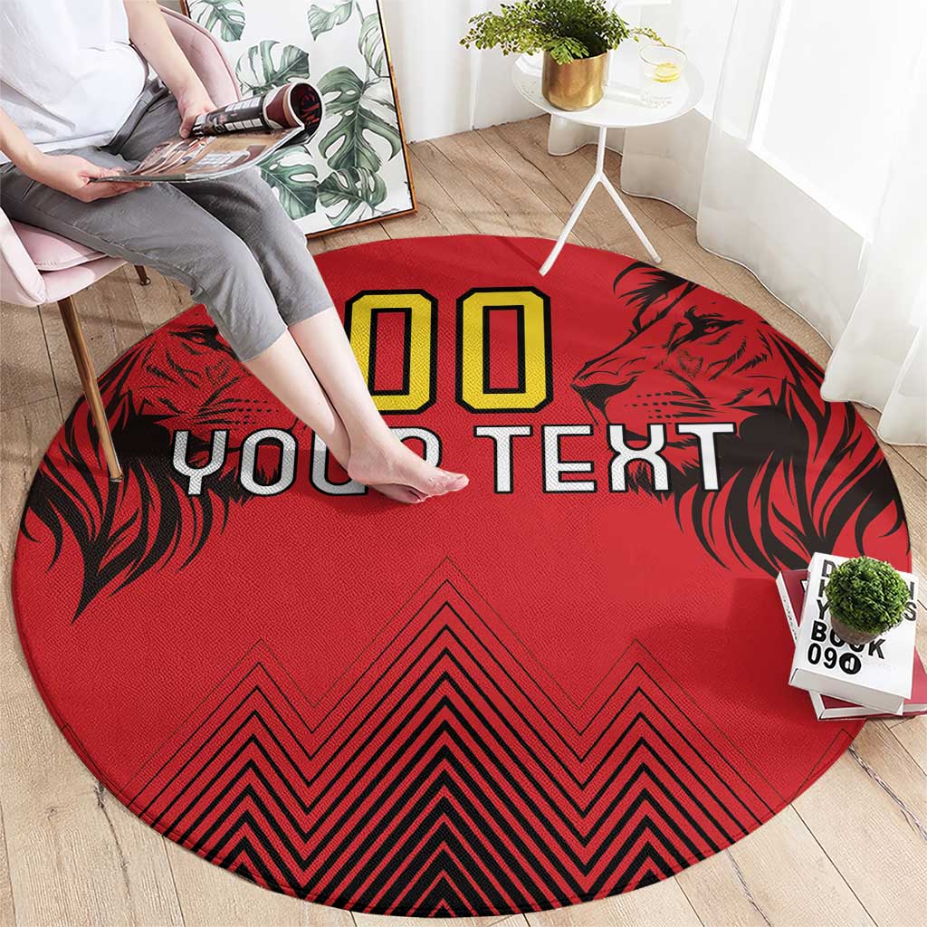 Round red rug with '00' and 'YOUR TEXT' graphic, black leaf sides, bold zigzag bottom
