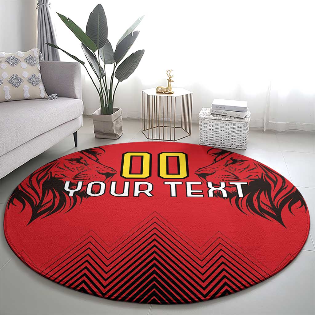 Round red rug featuring '00' above 'YOUR TEXT' with black leaf motifs and zigzag stripes