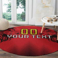 Round red rug with 'YOUR TEXT' and '00' in yellow squares, black zigzag and leaf shapes