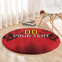 Round red rug with '00' and 'YOUR TEXT' centered, black leaf-style edges, zigzag design