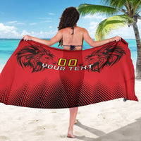 Red rugby-style sarong with back view lion head graphic, zigzag pattern and custom text.