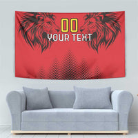 Red wall tapestry featuring black lion heads, zigzag bands, and 'YOUR TEXT' lettering