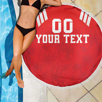 Red round beach blanket with white fringe and bold "YOUR TEXT" design with "00" at top