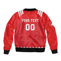 Red rugby bomber jacket back with black rib trim and white 'YOUR TEXT' graphic with '00'