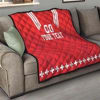 Red quilt blanket on sofa with white V stripes, “00” and “YOUR TEXT,” plus sign border