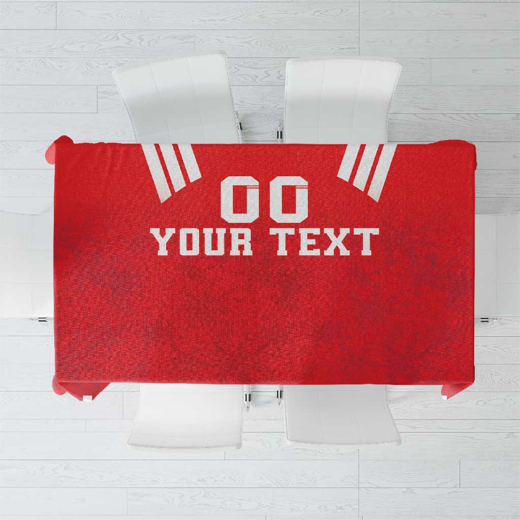 Red rugby tablecloth with white geometric pattern and "YOUR TEXT" print