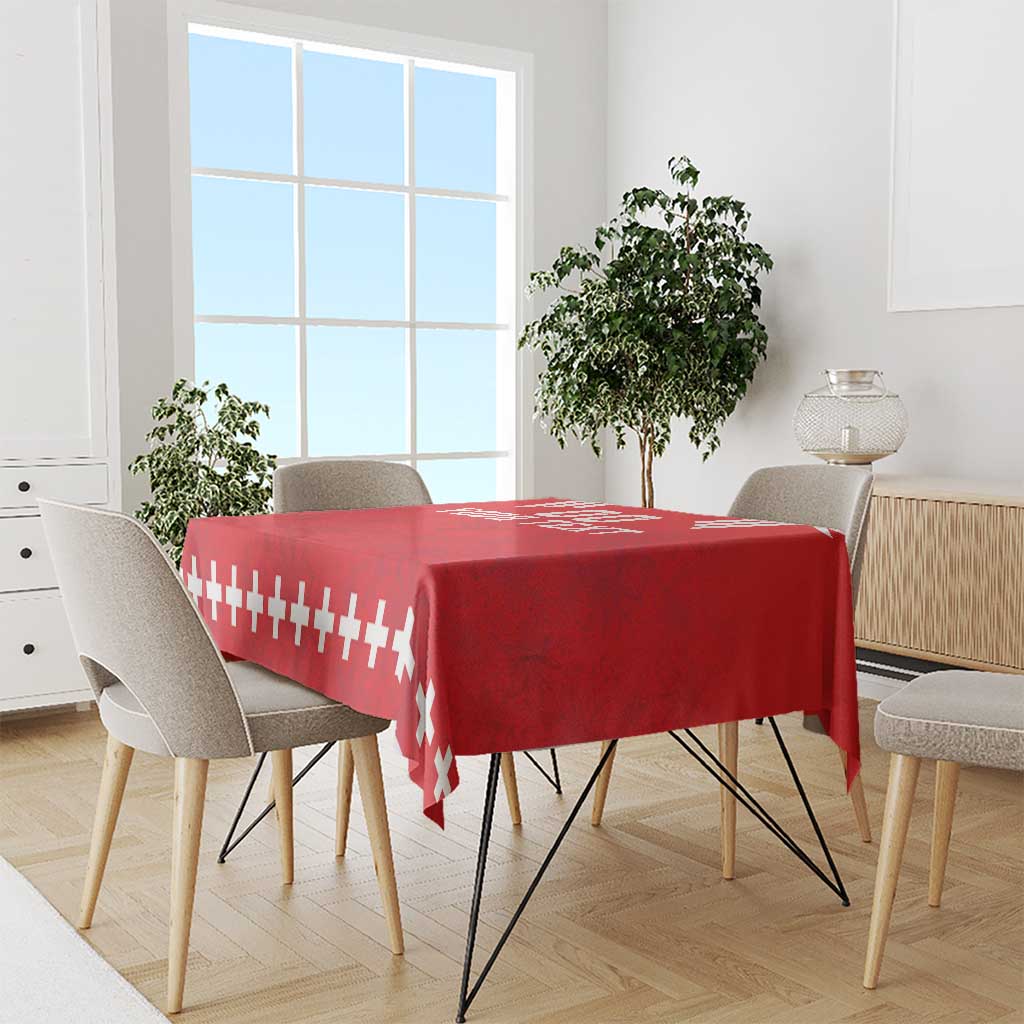 Red rugby tablecloth with white stripe and cross pattern on a dining table
