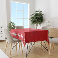 Red rugby tablecloth with white stripe and cross pattern on a dining table