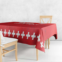 Red rugby tablecloth with white cross stripe pattern, overhang on dining bench
