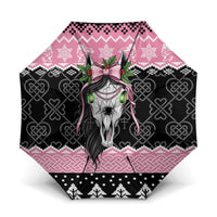 Pink and black Christmas umbrella with Mari Lwyd horse skull and Celtic knot pattern
