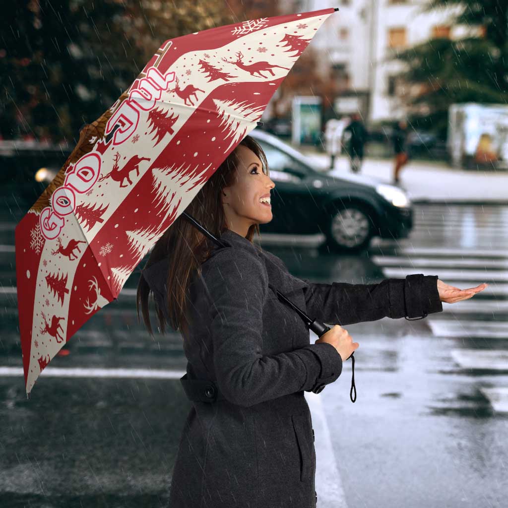 Red God Jul Christmas umbrella angled view with reindeer, fir trees, and snowflakes