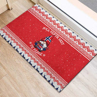 Red Nordic Christmas rubber doormat with zigzag border and gnome holding gift