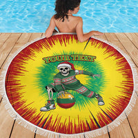 Round beach blanket with fringe edge, yellow-red-green sunburst and skeleton basketball artwork