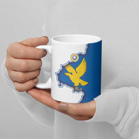Ceramic mug held in hands, blue flag panel with yellow eagle on white body