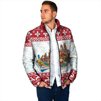 Red and white padded jacket on model, nativity scene print and zip-front.