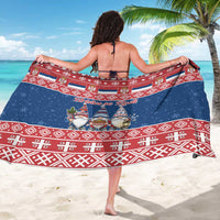 Christmas sarong worn as wrap, navy blue with red patterned band and gnome print