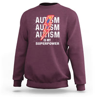 Maroon autism sweatshirt with front “AUTISM is my superpower” graphic and lightning icon