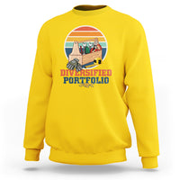 Yellow crewneck sweatshirt with “Diversified Portfolio” tools graphic on chest