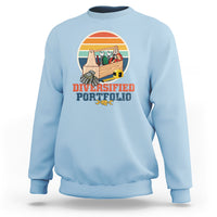 Sky blue crewneck sweatshirt with “Diversified Portfolio” tools graphic on chest