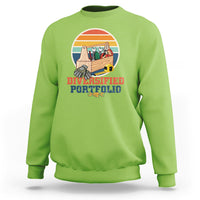 Green crewneck sweatshirt with “Diversified Portfolio” tools graphic on chest