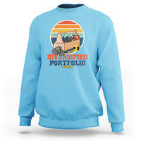 Light blue crewneck sweatshirt with “Diversified Portfolio” tools graphic on chest