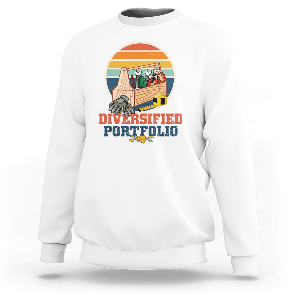 White crewneck sweatshirt with “Diversified Portfolio” tools graphic on chest