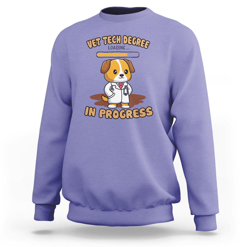 Violet vet tech degree sweatshirt with cartoon dog and “in progress” graphic on chest