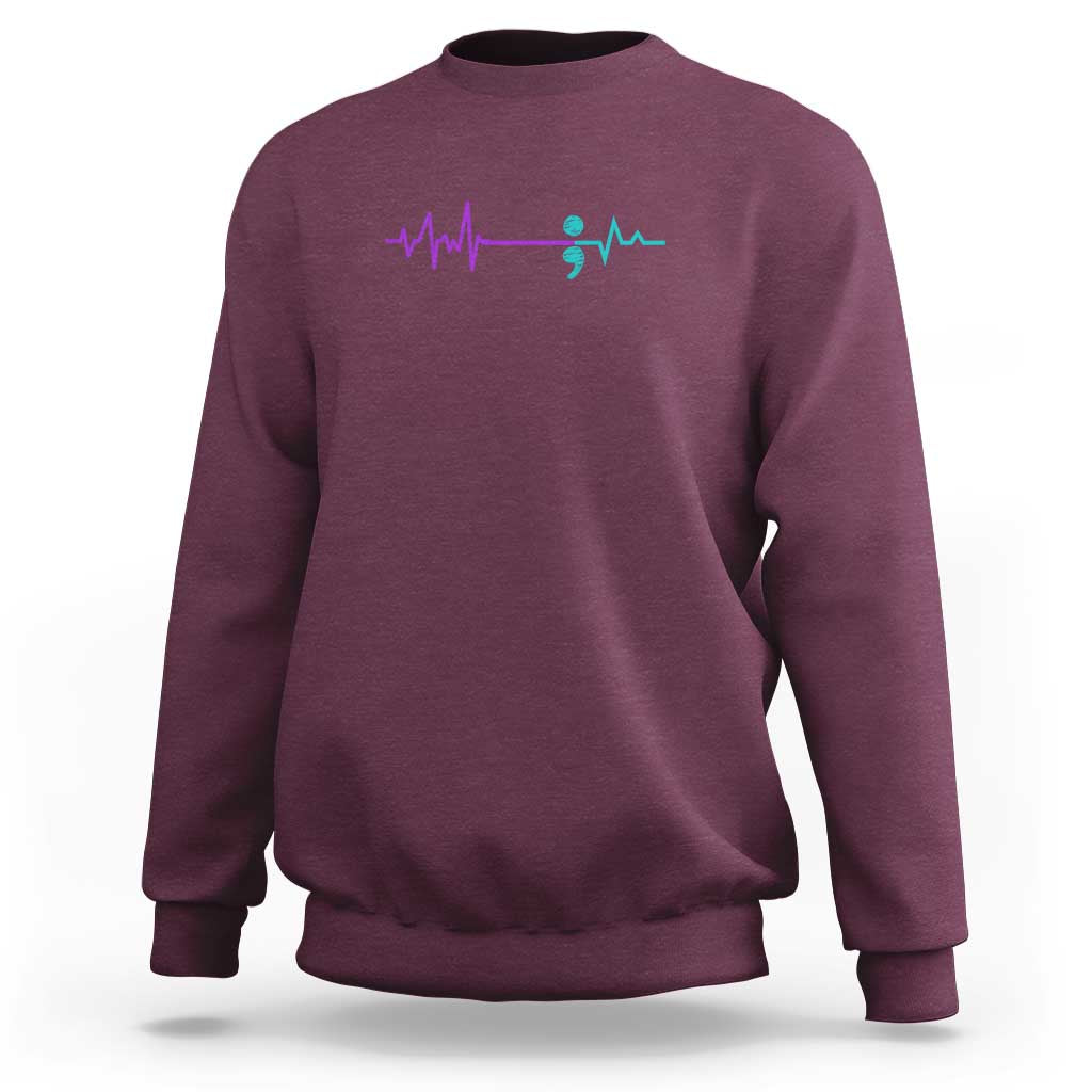 Maroon crewneck sweatshirt with left-chest ECG heartbeat and teal semicolon-style graphic