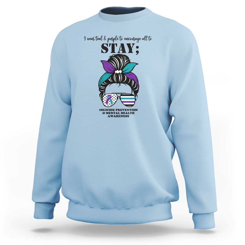 Light blue mental health support sweatshirt with “STAY” text and messy bun awareness graphic