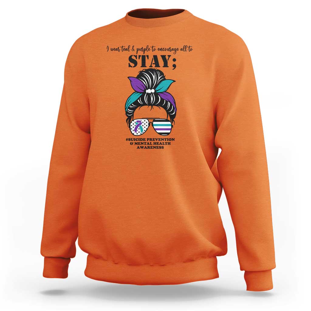 Orange mental health support sweatshirt with “STAY” text and messy bun awareness graphic