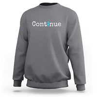 Charcoal gray crewneck sweatshirt with white “Continue” text and green semicolon graphic