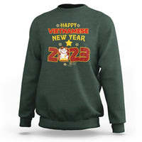 Dark green crewneck sweatshirt with 'Happy Vietnamese New Year 2023' graphic on chest.