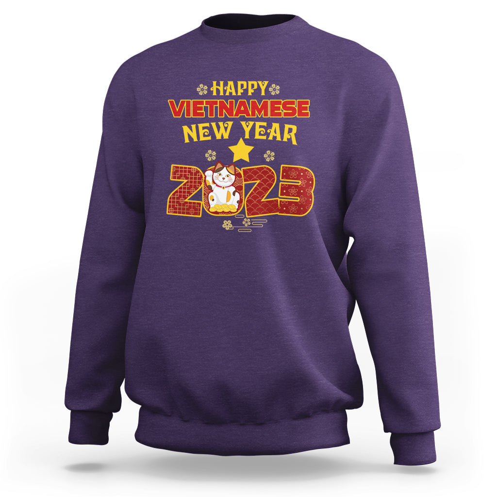Purple crewneck sweatshirt with 'Happy Vietnamese New Year 2023' graphic on chest.