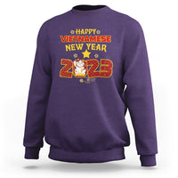 Purple crewneck sweatshirt with 'Happy Vietnamese New Year 2023' graphic on chest.
